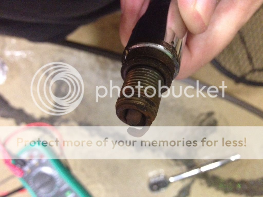 Brown rusty looking spark plug...rust or mmt aditive? Toyota FJ